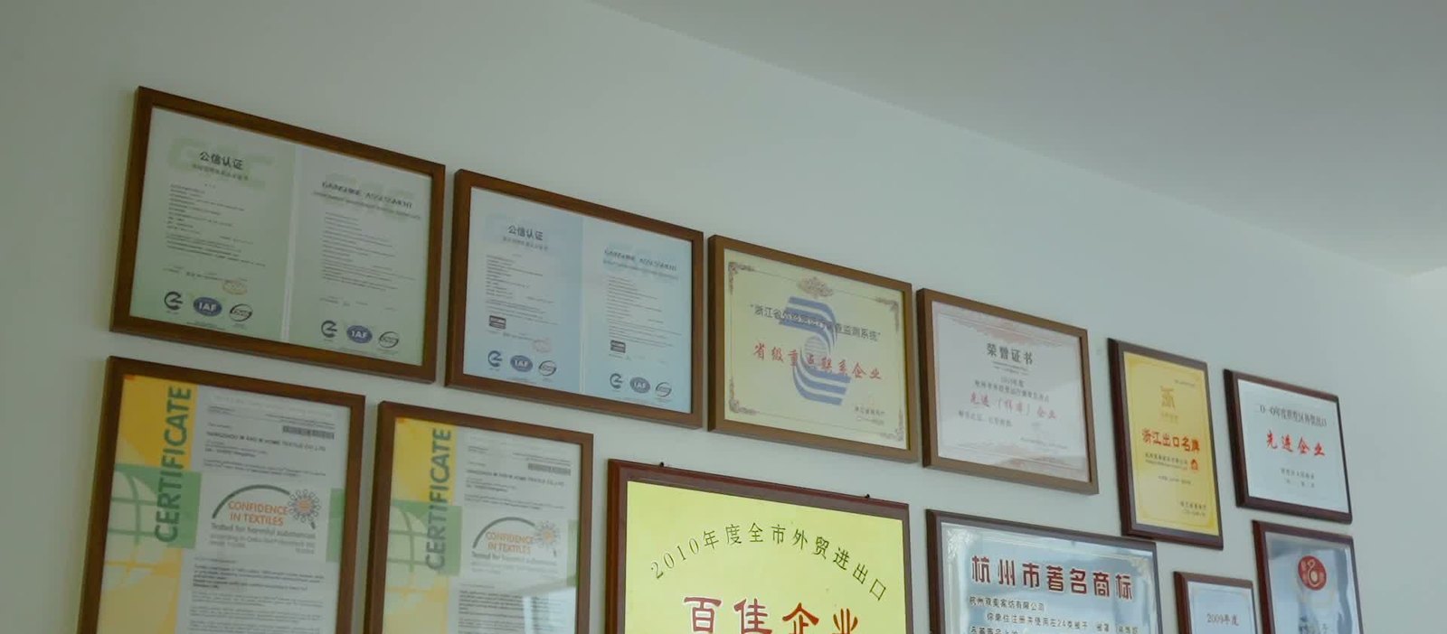 Certificate wall at M&M Home Textile