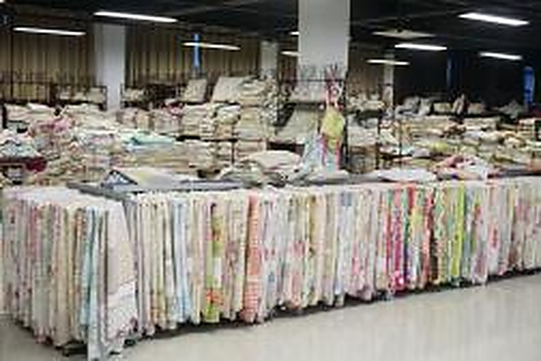 Booth wall, hanging textiles